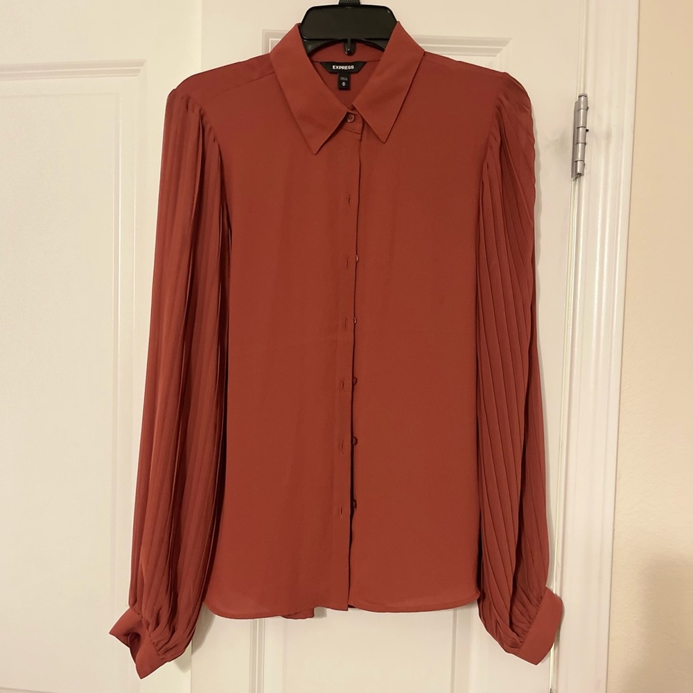 Express Size M Burnt orange long sleeved button down top. NWOT